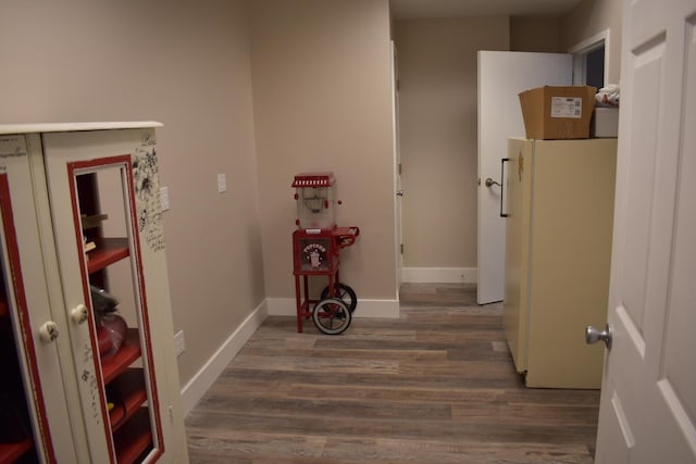 corridor featuring dark hardwood / wood-style floors