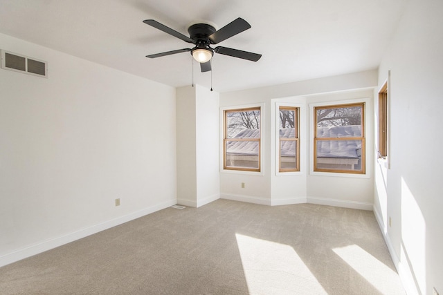 carpeted empty room with ceiling fan