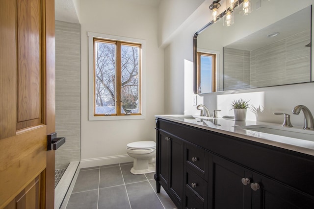 bathroom with toilet, tile patterned flooring, walk in shower, and vanity