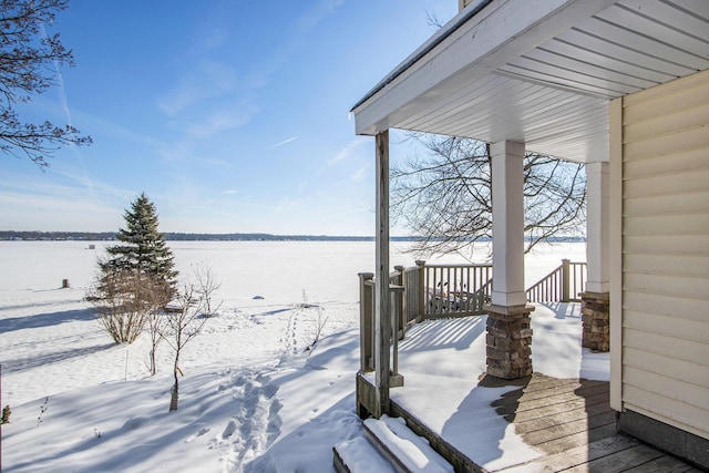 view of snow covered deck