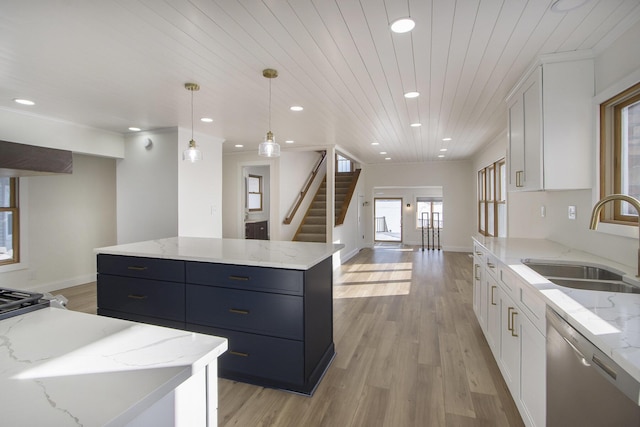 kitchen with wood ceiling, a center island, decorative light fixtures, white cabinets, and sink