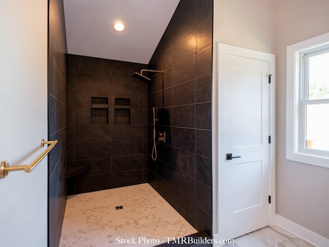 bathroom featuring tiled shower