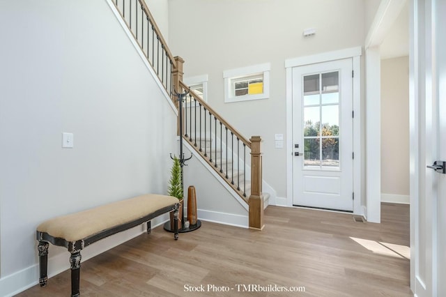 foyer entrance with light hardwood / wood-style flooring