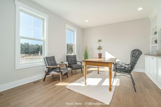 office area with light hardwood / wood-style flooring