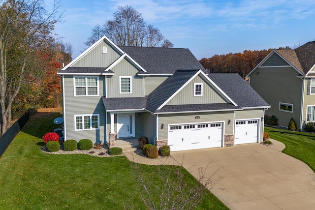 view of front of home with a garage and a front yard