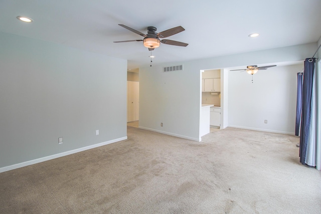 unfurnished living room with light carpet and ceiling fan