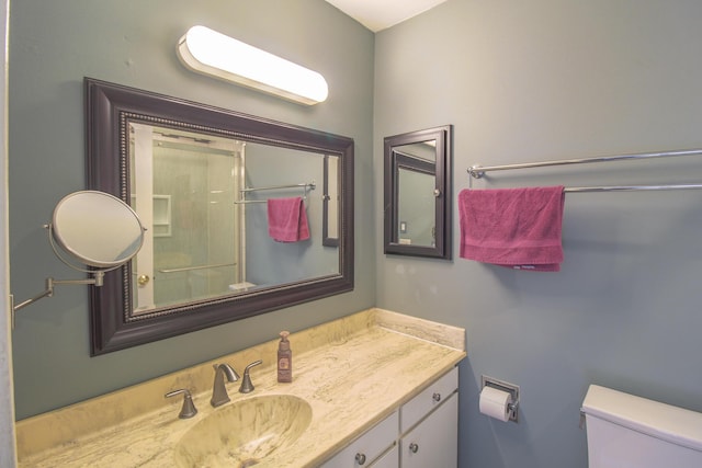 bathroom with toilet and vanity