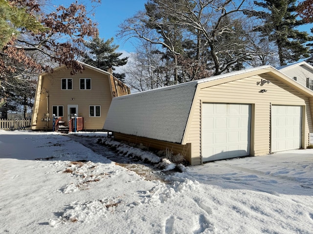 view of snow covered garage