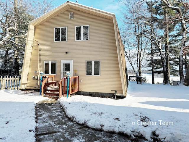 view of snow covered house