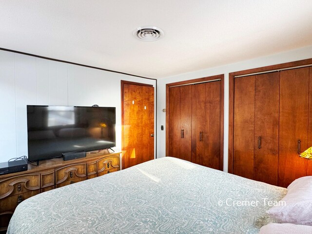 bedroom featuring two closets