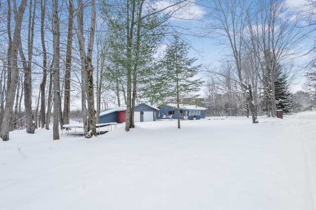 view of yard covered in snow