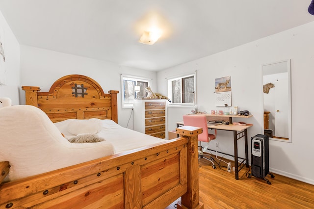 bedroom featuring wood-type flooring