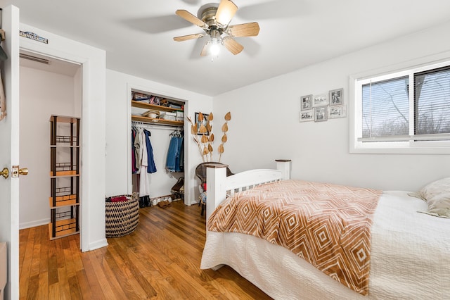 bedroom with ceiling fan, a closet, and hardwood / wood-style flooring