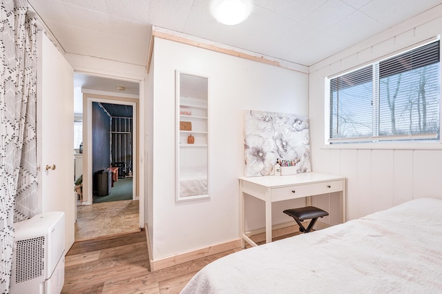 bedroom featuring light hardwood / wood-style floors