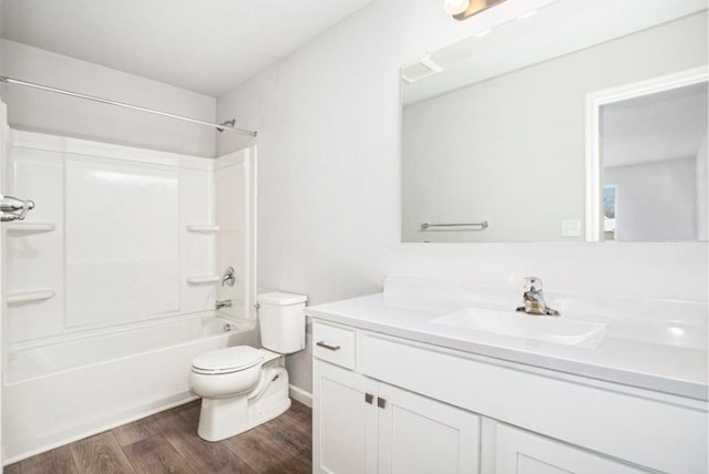 full bathroom with vanity, toilet, tub / shower combination, and hardwood / wood-style floors