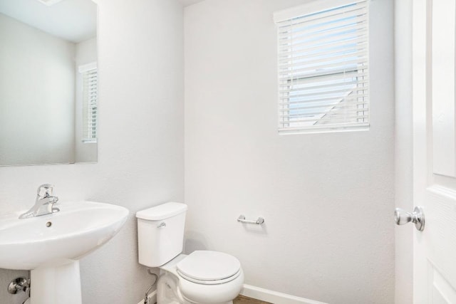 bathroom with sink and toilet