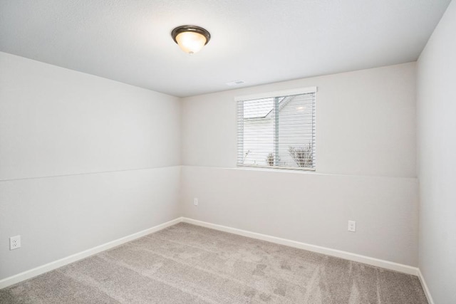 empty room featuring light colored carpet