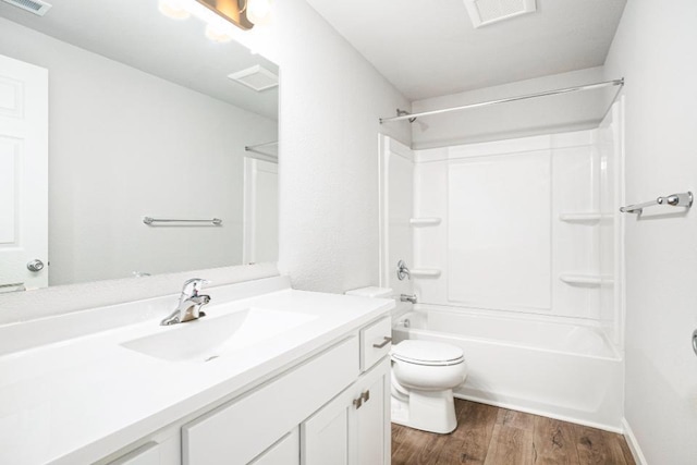 full bathroom with vanity, toilet, hardwood / wood-style floors, and shower / bathing tub combination