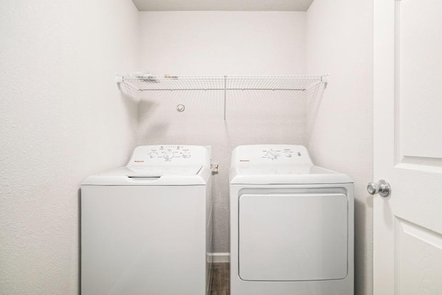 laundry room with washing machine and dryer