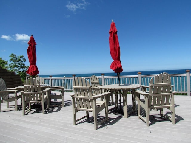 wooden deck featuring a water view