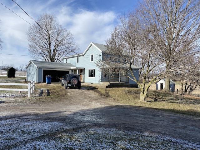 view of front of property with an outbuilding