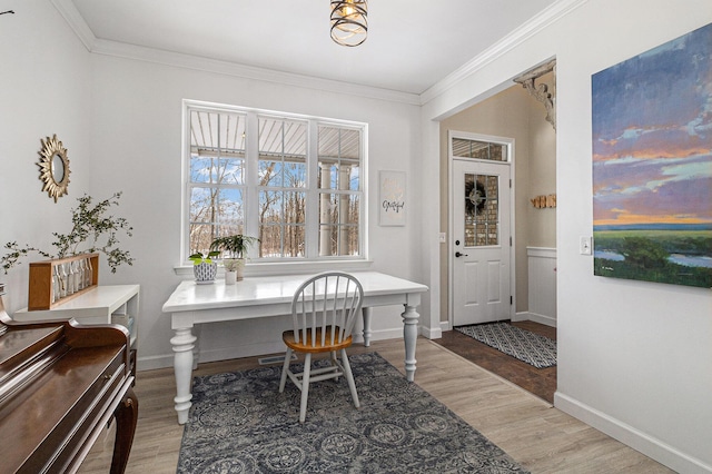 office area with wood-type flooring and ornamental molding