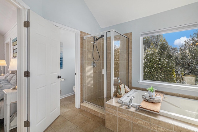 bathroom with lofted ceiling, a healthy amount of sunlight, tile patterned floors, and shower with separate bathtub