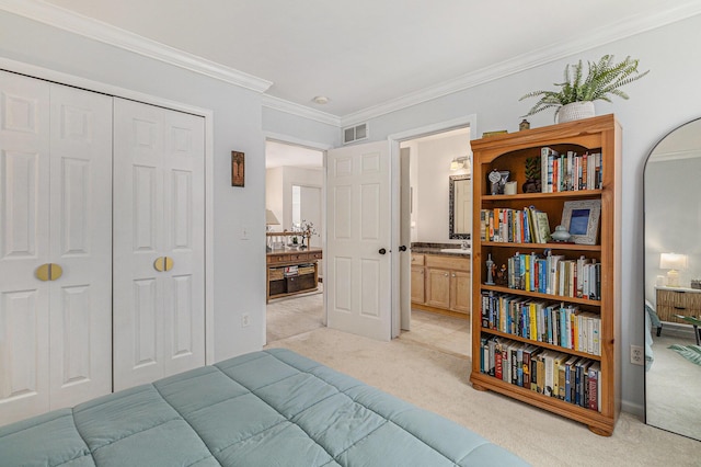 carpeted bedroom with a closet and ornamental molding