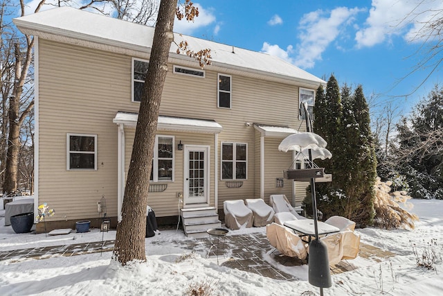 view of snow covered house