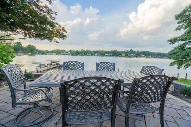 view of patio / terrace featuring a dock and a water view