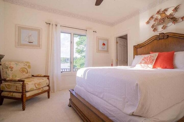 bedroom featuring ceiling fan and light carpet