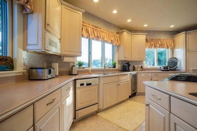 kitchen with wine cooler, sink, paneled dishwasher, light tile patterned flooring, and stainless steel gas cooktop