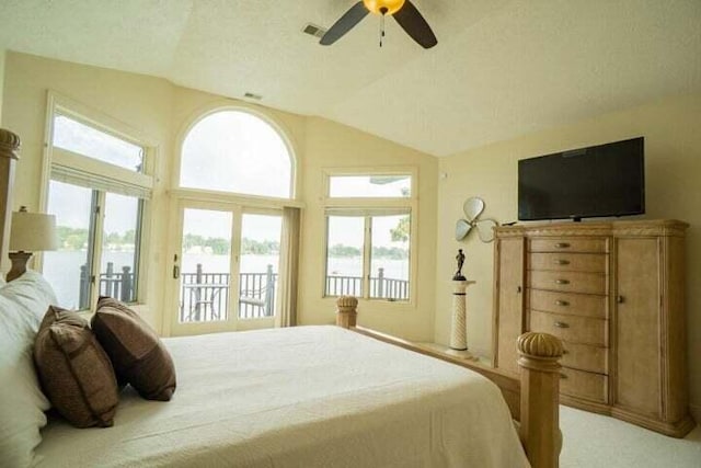 bedroom featuring access to outside, vaulted ceiling, and ceiling fan