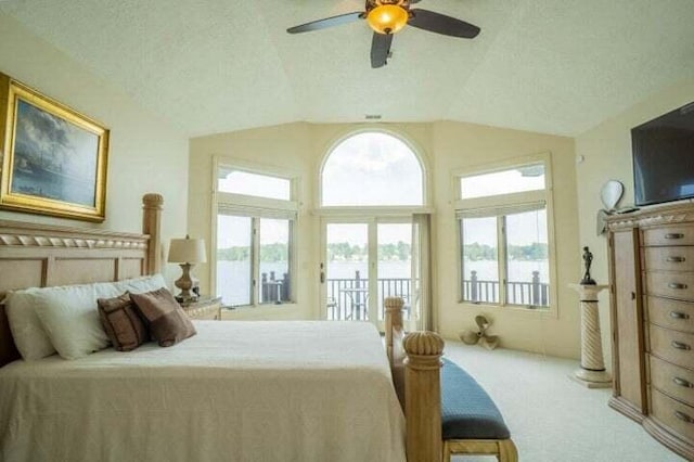 carpeted bedroom with ceiling fan, a textured ceiling, lofted ceiling, and access to outside