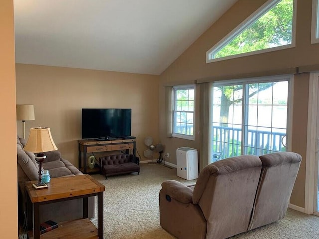 living room featuring light carpet and vaulted ceiling