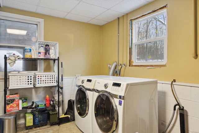 washroom with washing machine and clothes dryer