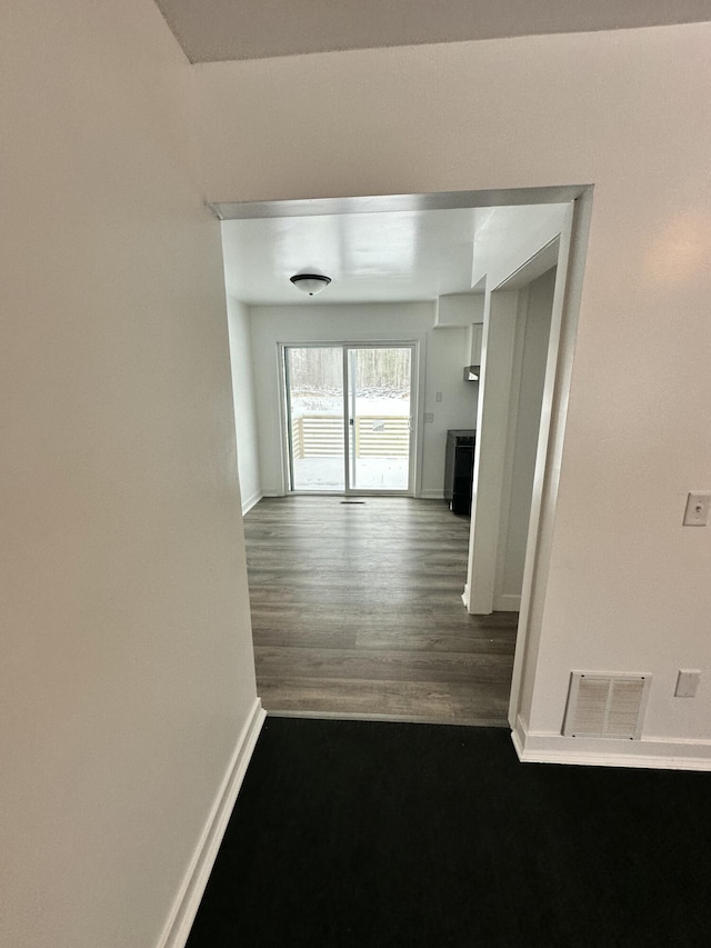 hall featuring dark hardwood / wood-style floors