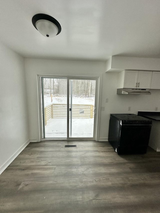 interior space with a wealth of natural light and light hardwood / wood-style floors