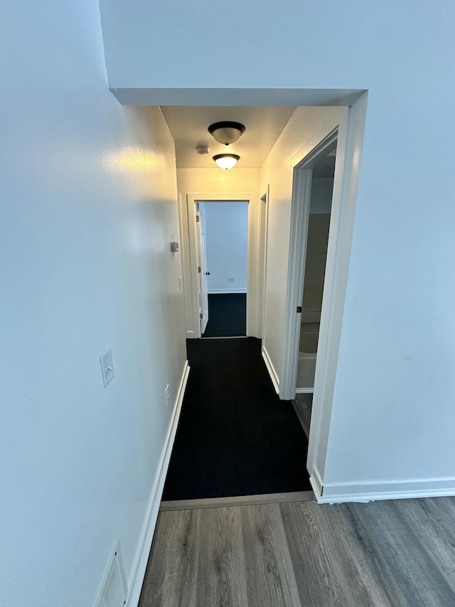 hall featuring dark hardwood / wood-style floors