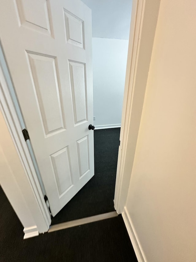 corridor with carpet floors