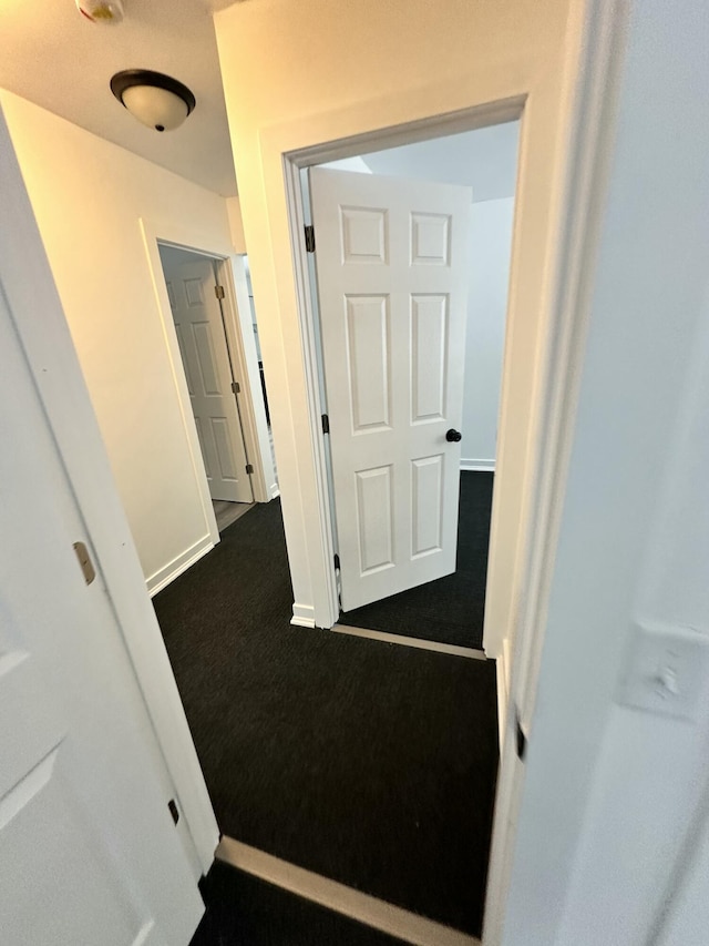 hallway with carpet