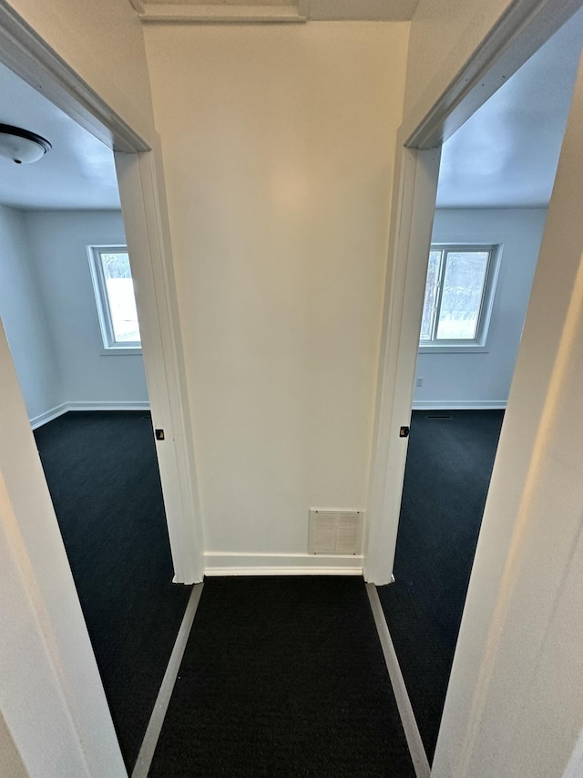 corridor featuring carpet floors