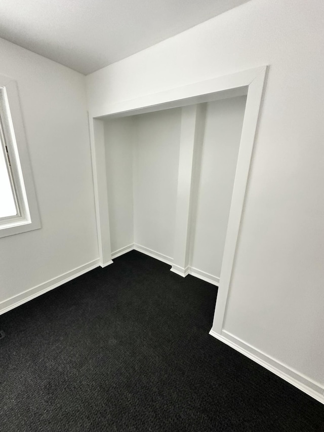 basement with dark carpet