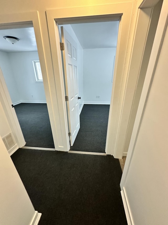 corridor with carpet floors