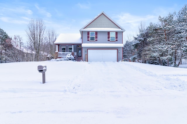 view of front of house with a garage and a porch