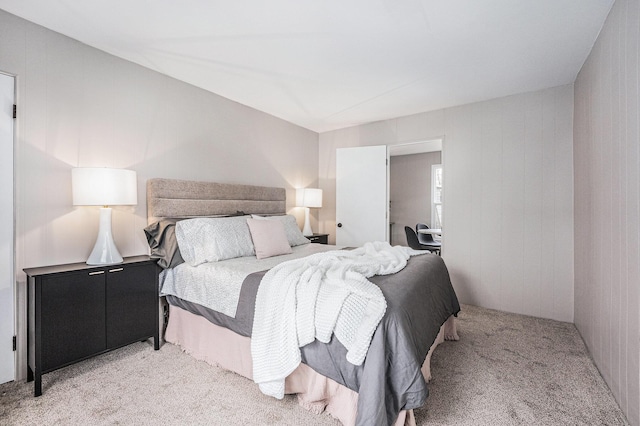 bedroom featuring light carpet