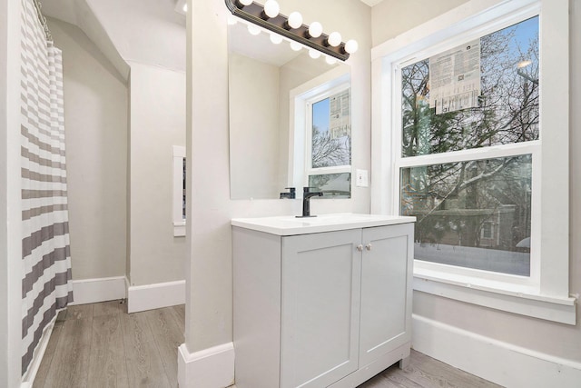 bathroom featuring wood-type flooring and vanity