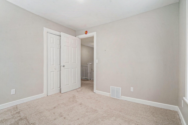 unfurnished bedroom featuring carpet