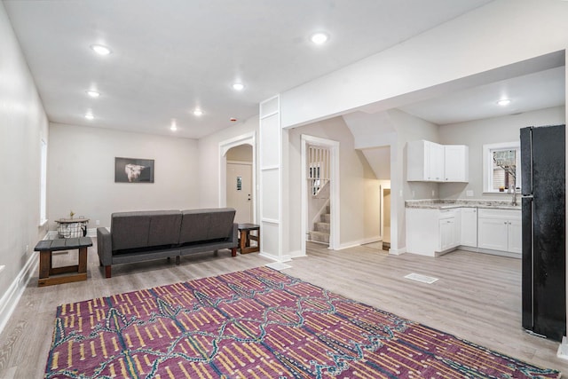 living room featuring light wood-type flooring