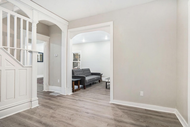 corridor featuring hardwood / wood-style floors